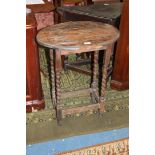 A 1940's oak oval occasional table with moulded edge top on long slender legs with stretchers