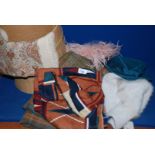 A quantity of hats, travel rug, scarves, etc.