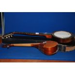 An old Banjo with mother of pearl inlay, cased; along with a wooden lute, a/f