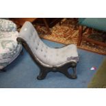 A 19th c. ebonised empire style child's Chair having pastel blue button upholstery, shaped sides