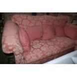 A large two seater scroll arm Settee in mulberry ground floral fabric upholstery with five similar