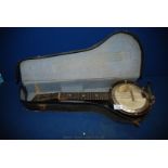 A cased British Banjo Ukulele by Down South JTC - L.