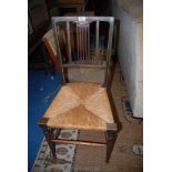 An Edwardian Mahogany bedroom Chair, having boxwood strung back with inlaid top rail, rush seat,