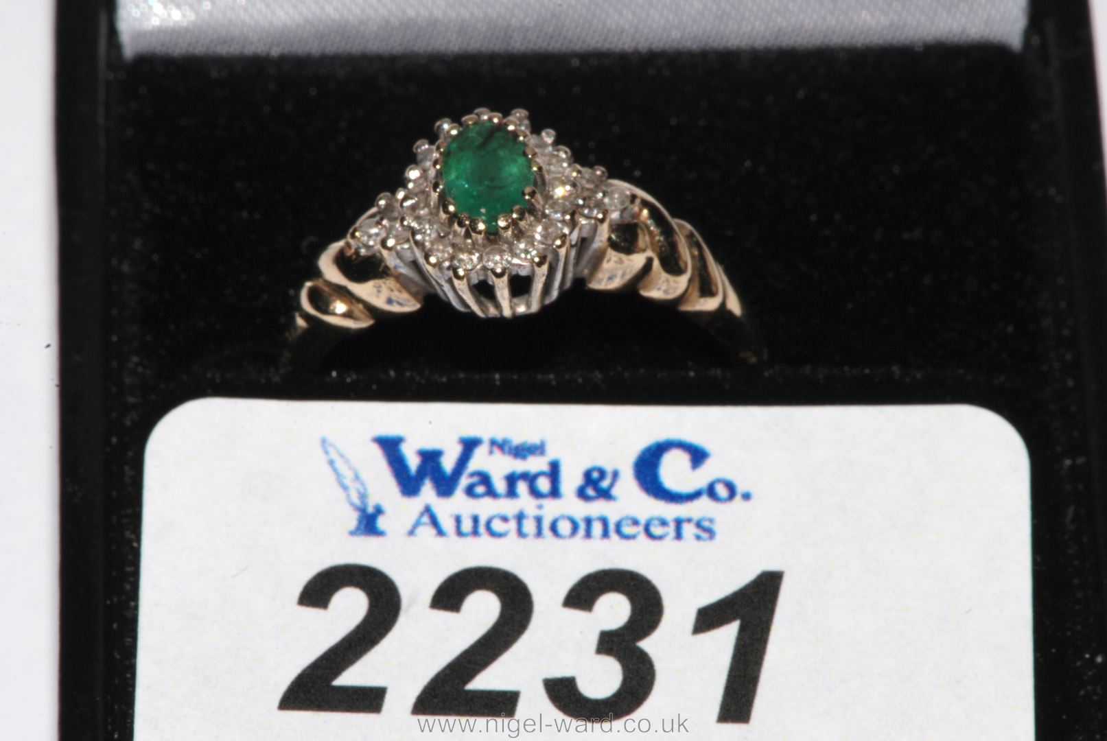 A 9ct. yellow gold Emerald & Diamond cluster RIng, hallmarked, with valuation certificate