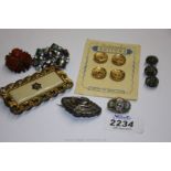 A box containing a set of Buttons, three odd Buttons and four Brooches, etc.