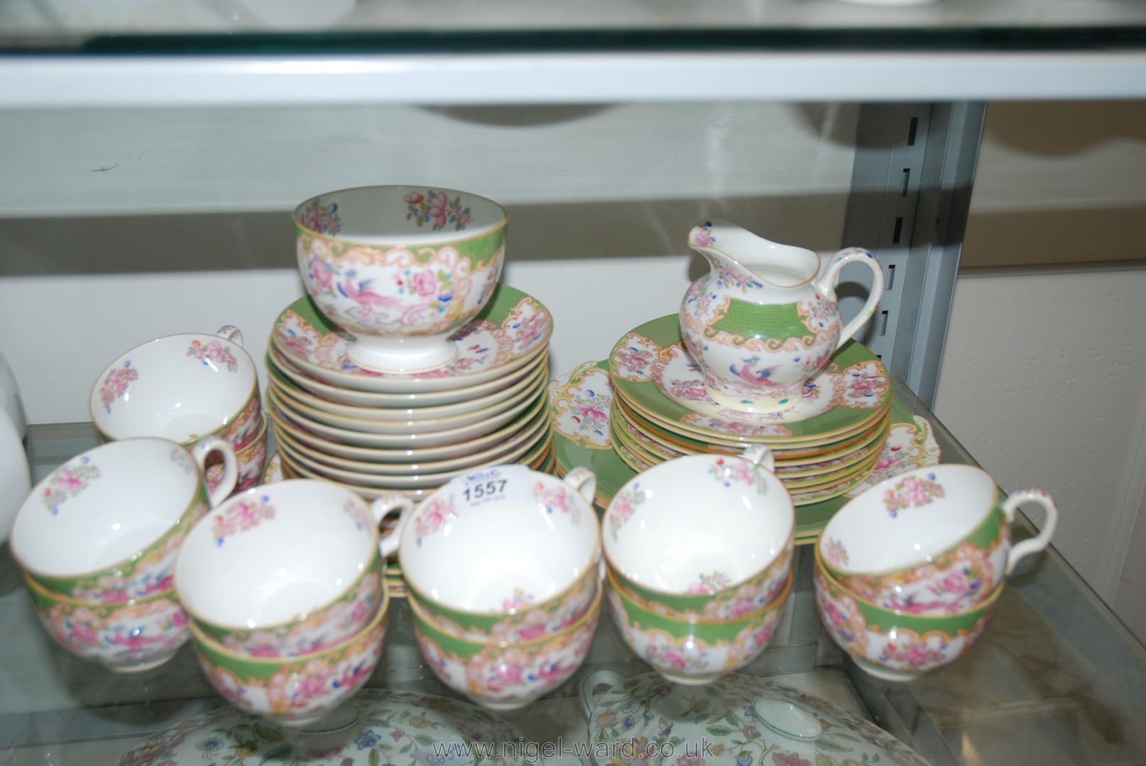 A Minton 'Cockatrice' part Teaset comprising twelve cups and saucers, twelve tea plates, milk jug,