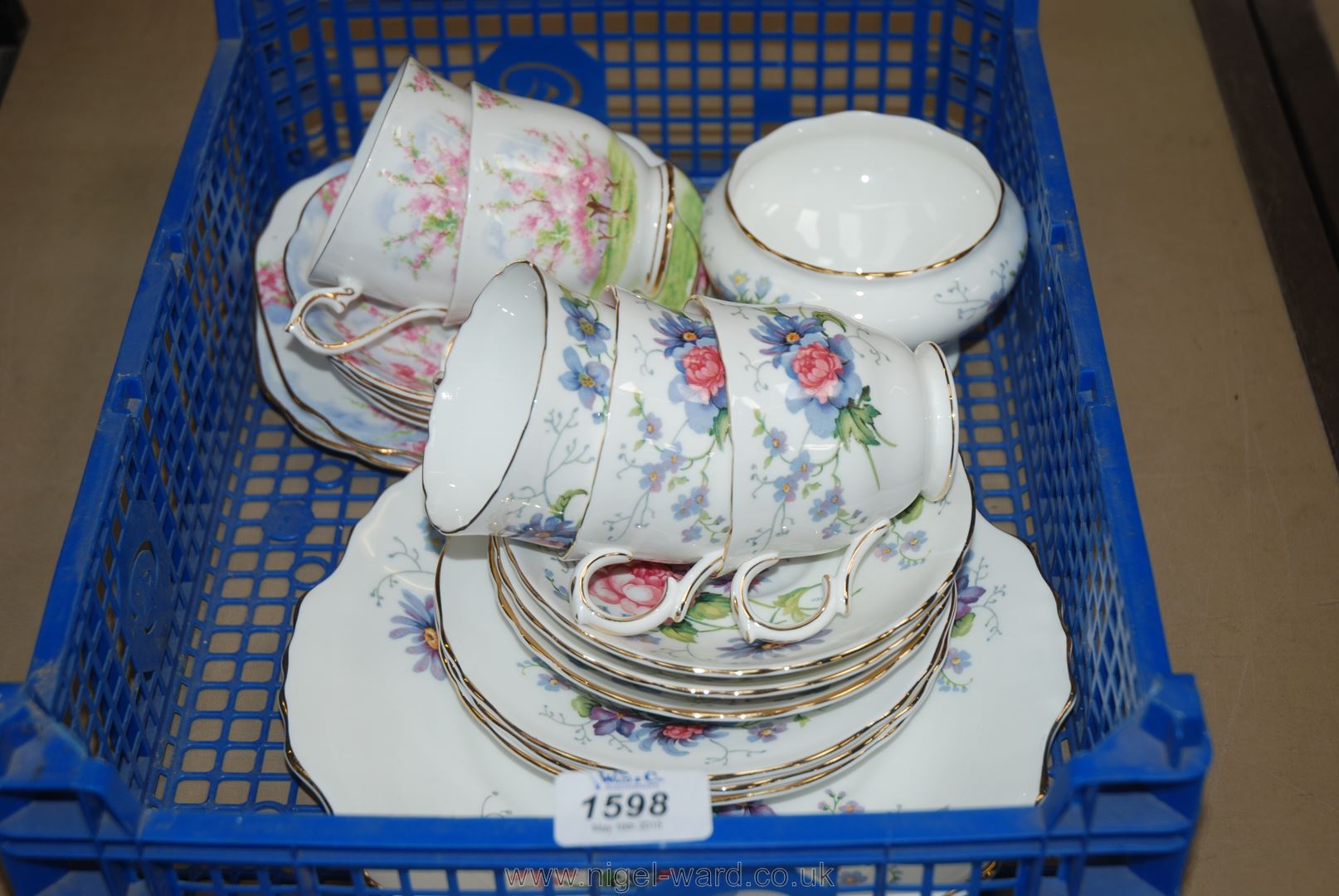 A Crown Staffordshire part Teaset of three cups, saucers and tea plates,