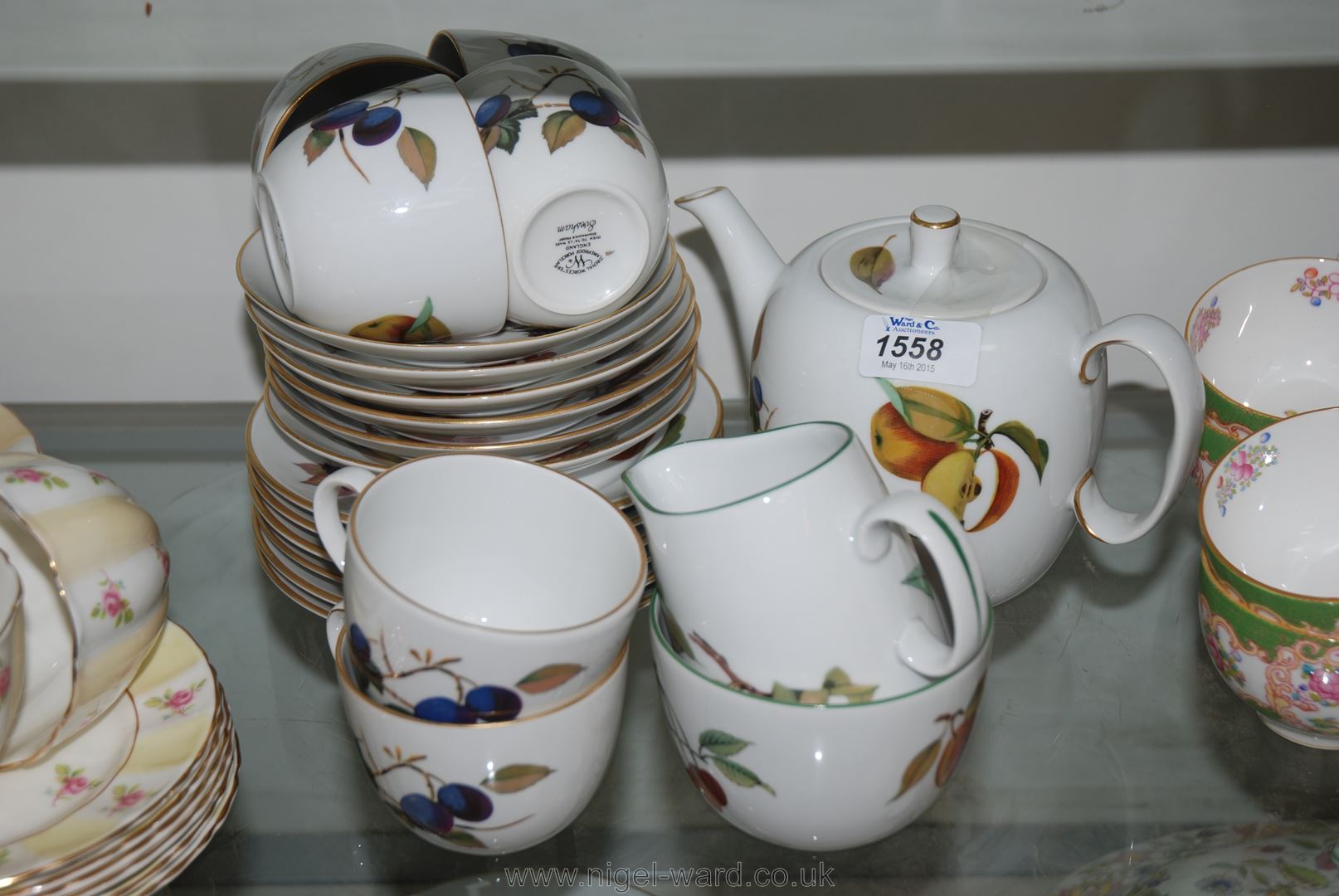 A Royal Worcester Evesham Teaset consisting six cups and saucers, six tea plates, milk jug,