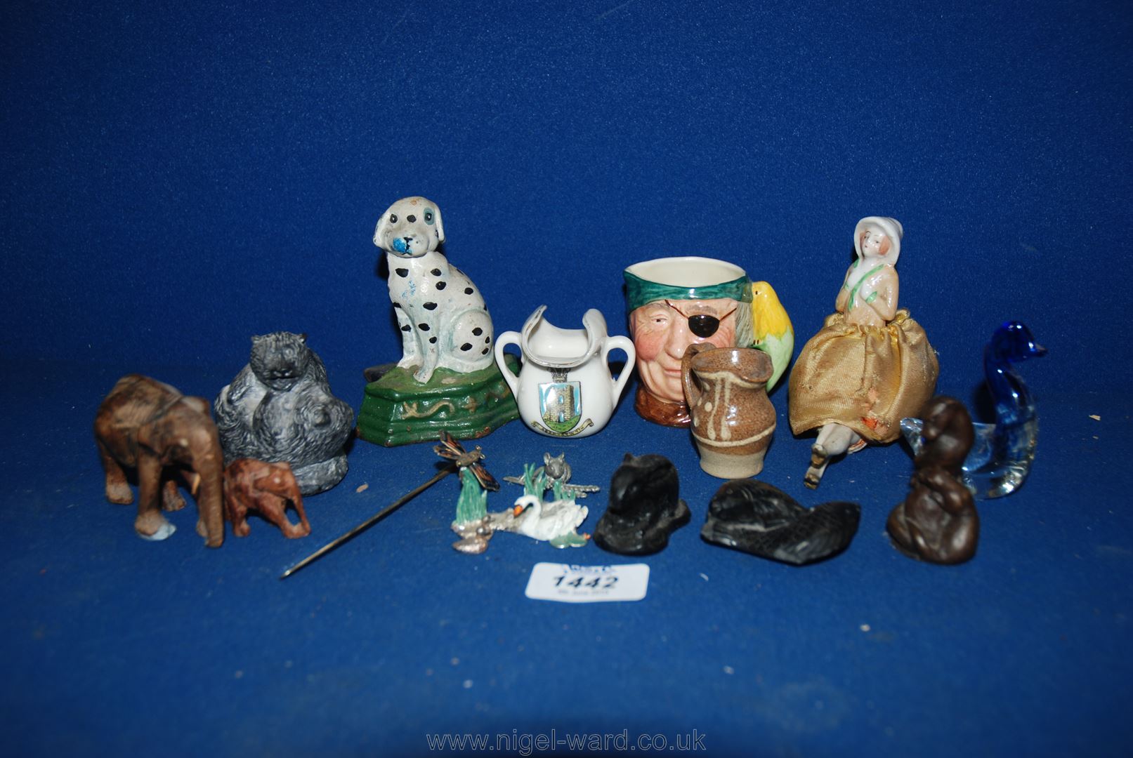 A quantity of miscellanea including coal model of a rabbit, stone model of fish, cast dog door peg,