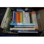 A box of books  including James Heriot, John Wyndham, Power Boating etc.