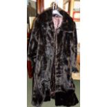 Full length dark brown faux fur coat