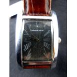 Gents fashion wristwatch on leather strap. Working at lotting up.