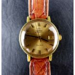 Ladies Omega wristwatch on tan leather strap. Working at lotting up.