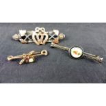 Silver & gold bar brooch, a silver and enamel brooch and a yellow metal bar brooch with a ruby and