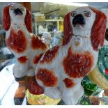 Pair of small russet Staffordshire spaniels