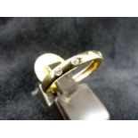 9 ct gold diamond set band. Size O.