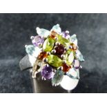 Sterling silver multicolour stone set ring. One stone missing.