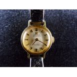 Ladies Omega De Ville automatic ladies wristwatch on leather strap. Working at lotting up.