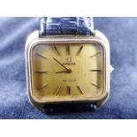 Gents Omega De Ville rectangular faced gold plated wristwatch. Working at lotting up.