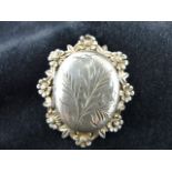 Hallmarked silver floral set locket, Birmingham 1926. Maker JS.