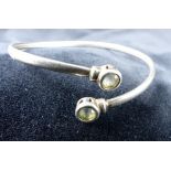 Sterling silver peridot set bangle.