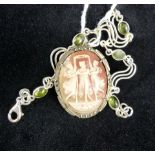 Silver mounted three graces cameo brooch and a silver & peridot bracelet.