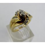 14ct diamond ring with eight small baguette, six side stones and a central stone. Size I.