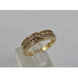 14ct gold eternity ring with crossover design. Size O