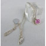 Pink and white stone pendant on silver chain