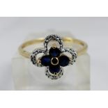 9ct gold sapphire flower shaped ring, size N