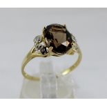 9 ct gold smoky quartz and diamond ring. Size O.