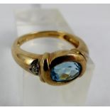 9 ct gold blue topaz & diamond ring. Size L/M.