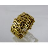 Heavy 9ct gold ring in bark design, size R. Weight 9.4g