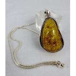 Large Sterling silver set Baltic amber pendant on a silver snake chain.