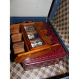 Vintage suitcase with quantity of ceramic thimbles and small thimble display case