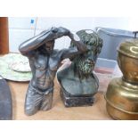 Bust of a man on marble base and one other metal figure of a topless man