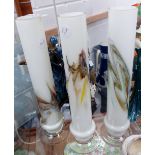 Three standing glass vases. H: 30 cm
