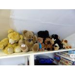 Shelf of mixed childs stuffed teddy bears