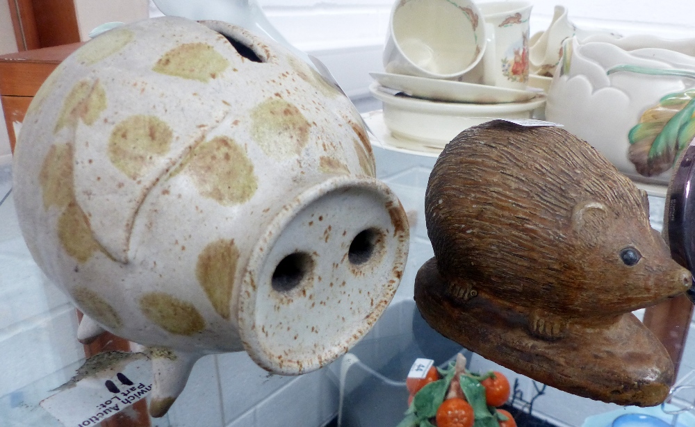 Ceramic money box in the form of a pig, plus a hedgehog mantle ornament