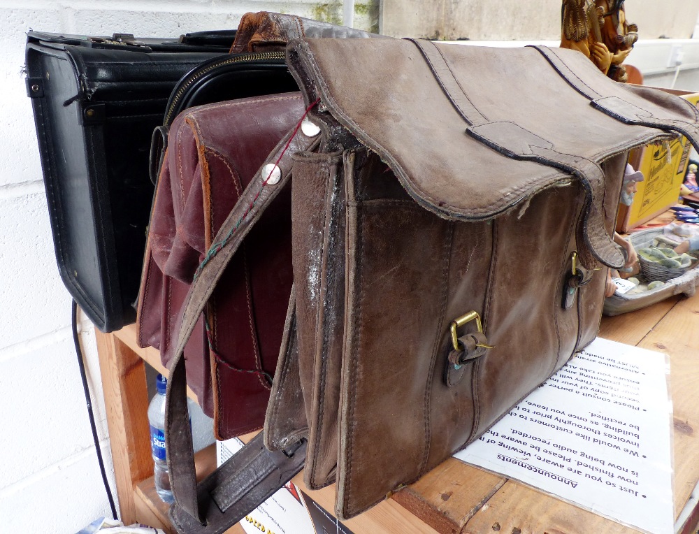 Five vintage leather briefcases