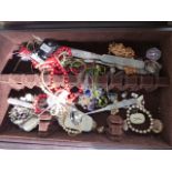 Costume jewellery in wooden cutlery box