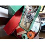 Tin of vintage sewing items including buttons and Singer boxed parts