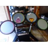 Guitar Hero drum kit with pedal and drumsticks. Includes EG~10J guitar amplifier