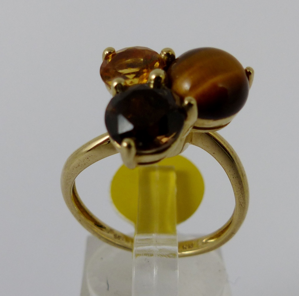 9ct gold three stone head ring with citrine, tigers eye and smokey quartz