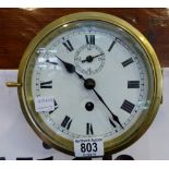 Brass cased marine clock with seconds dial.