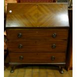 Small lockable mahogany bureau on Queen Anne style legs.