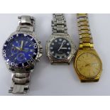 Box of three gents fashion wristwatches