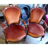 Two upholstered elbow chairs