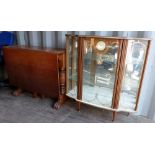 Wooden glazed drinks cabinet with Smiths clock to front and a dropleaf table