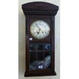 Oak cased chiming wall clock with pendulum and keys